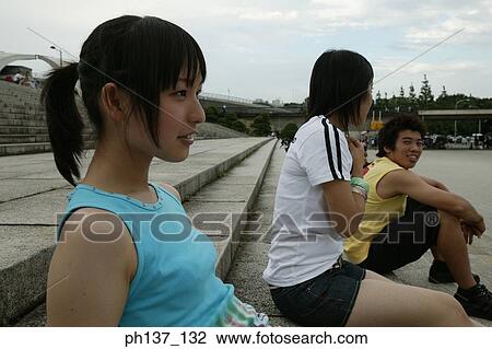 Teenagers sitting on steps View Large Photo Image Stock Image - Teenagers sitting on steps. Fotosearch