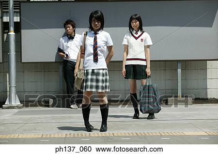 Teenagers standing together View Large Photo Image Stock Image - Teenagers standing together. Fotosearch