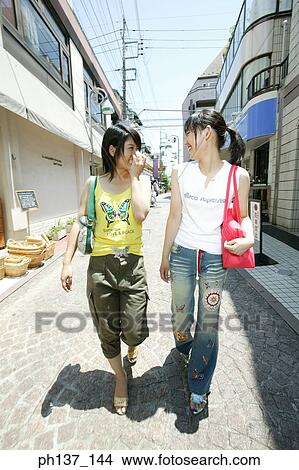 Teenagers walking and talking View Large Photo Image Picture - Teenagers walking and talking. Fotosearch