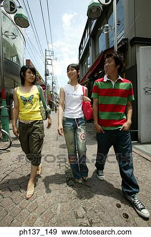 Teenagers walking and talking View Large Photo Image Stock Photo - Teenagers walking and talking. Fotosearch