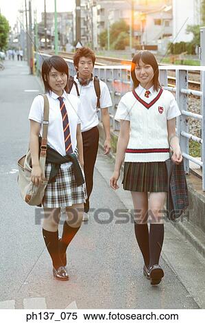 Stock Photography - Teenagers walking together. Fotosearch
