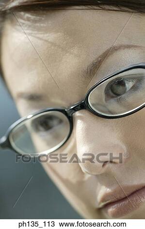 Young businesswoman wearing eye glasses View Large Photo Image Stock Image - Young businesswoman wearing eye glasses. Fotosearch