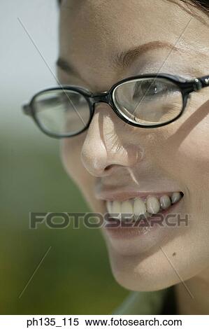 Young businesswoman wearing eye glasses View Large Photo Image Stock Photography - Young businesswoman wearing eye glasses. Fotosearch