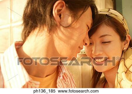 Young couple holding each other View Large Photo Image Stock Photography - Young couple holding each other. Fotosearch