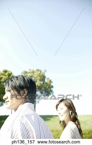 Young couple looking ahead View Large Photo Image Stock Photo - Young couple looking ahead. Fotosearch