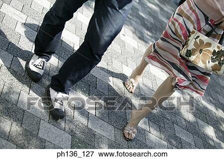 Stock Photo - Young couple walking. Fotosearch