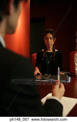 Stock Photo - Businessman and a businesswoman in a meeting. Fotosearch