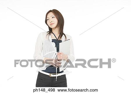 Close-up of a businesswoman holding files View Large Photo Image Stock Photo - Close-up of a businesswoman holding files. Fotosearch