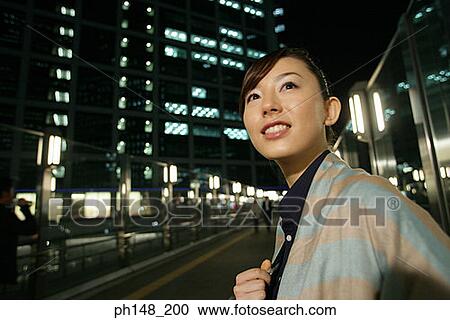 Close-up of a young woman smiling View Large Photo Image Stock Image - Close-up of a young woman smiling. Fotosearch