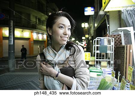 Close-up of a young woman smiling View Large Photo Image Stock Photography - Close-up of a young woman smiling. Fotosearch