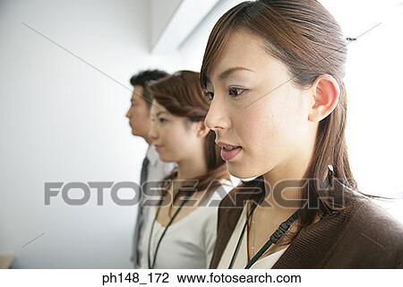 Close-up of business executives standing in a row and thinking View Large Photo Image Stock Image - Close-up of business executives standing in a row and thinking. Fotosearch