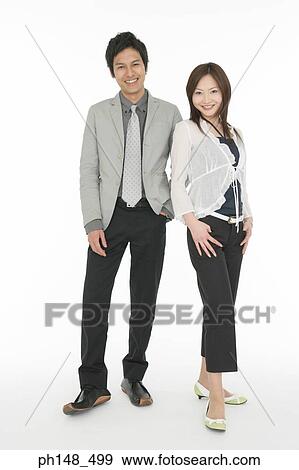 Portrait of a businessman and a businesswoman smiling View Large Photo Image Stock Photo - Portrait of a businessman and a businesswoman smiling. Fotosearch