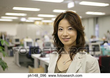 Stock Photograph - Portrait of a businesswoman smiling. Fotosearch