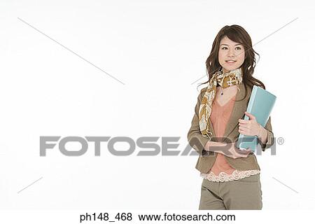 Stock Photo - Portrait of a young woman holding a file. Fotosearch
