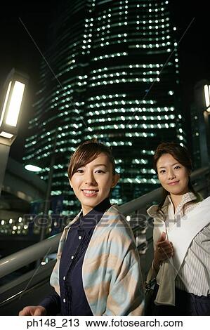 Portrait of two young women smiling View Large Photo Image Stock Image - Portrait of two young women smiling. Fotosearch
