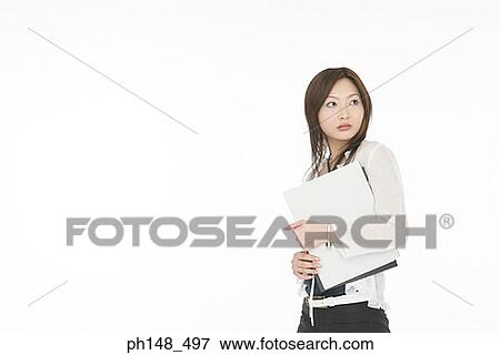Side profile of a businesswoman holding files View Large Photo Image Stock Photo - Side profile of a businesswoman holding files. Fotosearch