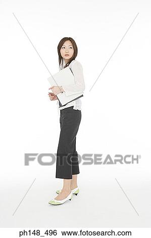 Side profile of a businesswoman holding files View Large Photo Image Stock Photograph - Side profile of a businesswoman holding files. Fotosearch