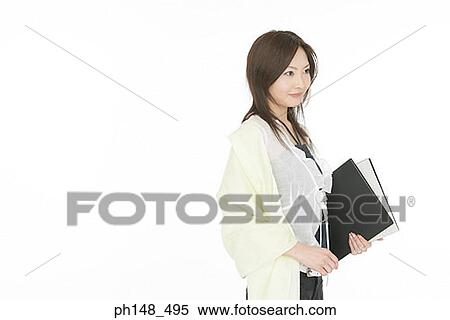 Side profile of a businesswoman holding files View Large Photo Image Stock Photography - Side profile of a businesswoman holding files. Fotosearch