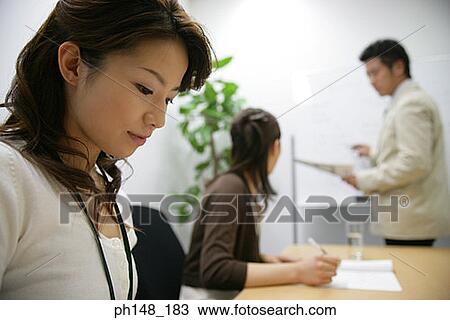 Side profile of two businesswomen and a businessman in a conference room View Large Photo Image Stock Image - Side profile of two businesswomen and a businessman in a conference room. Fotosearch