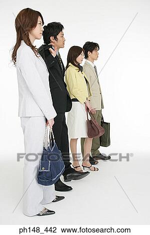 Side profile of two businesswomen and two businessmen standing in a row View Large Photo Image Stock Image - Side profile of two businesswomen and two businessmen standing in a row. Fotosearch