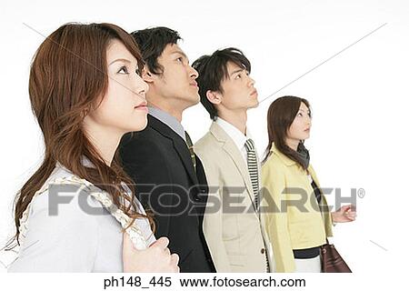 Side profile of two businesswomen and two businessmen looking up View Large Photo Image Stock Photography - Side profile of two businesswomen and two businessmen looking up. Fotosearch