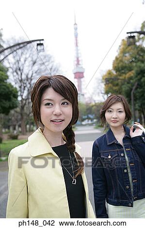 Two businesswomen in a park View Large Photo Image Stock Image - Two businesswomen in a park. Fotosearch