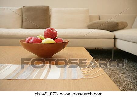 Bowl of apples on a coffee table in the living room View Large Photo Image Stock Image - Bowl of apples on a coffee table in the living room. Fotosearch