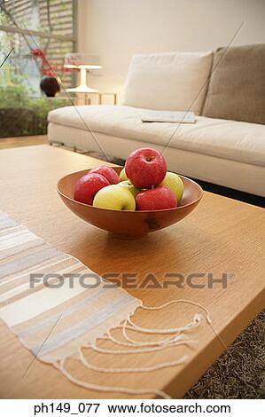 Bowl of apples on a table in the living room View Large Photo Image Stock Photo - Bowl of apples on a table in the living room. Fotosearch