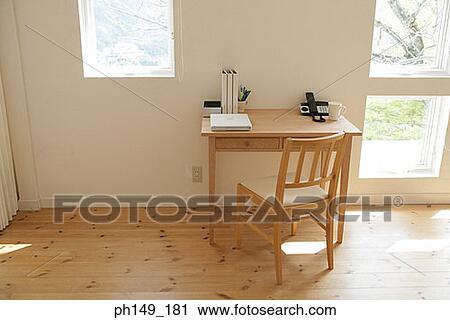 Chair and a table in the living room View Large Photo Image Stock Image - Chair and a table in the living room. Fotosearch
