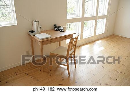 Stock Image - Chair and a table in the living room. Fotosearch