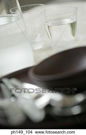 Picture - Close-up of a bowl and spoons with two glasses of water. Fotosearch