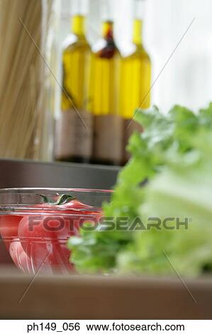 Close-up of a bowl of tomatoes View Large Photo Image Stock Photograph - Close-up of a bowl of tomatoes. Fotosearch