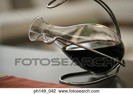 Close-up of a flask of wine on a holder View Large Photo Image Stock Image - Close-up of a flask of wine on a holder. Fotosearch