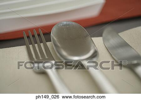 Close-up of a fork and a spoon with a table knife View Large Photo Image Stock Photograph - Close-up of a fork and a spoon with a table knife. Fotosearch