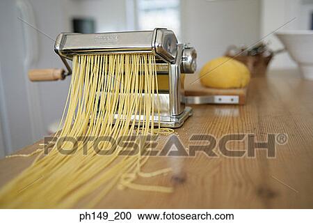 Stock Image - Close-up of a pasta maker. Fotosearch
