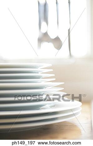 Close-up of a stack of plates View Large Photo Image Stock Photo - Close-up of a stack of plates. Fotosearch
