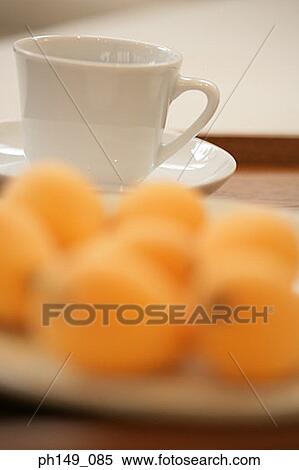 Close-up of a tea cup with a saucer and ripe loquats View Large Photo Image Stock Photography - Close-up of a tea cup with a saucer and ripe loquats. Fotosearch