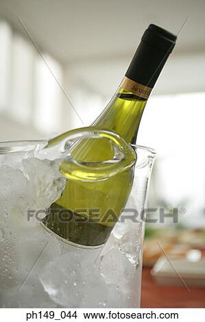 Close-up of a wine bottle in an ice bucket View Large Photo Image Picture - Close-up of a wine bottle in an ice bucket. Fotosearch