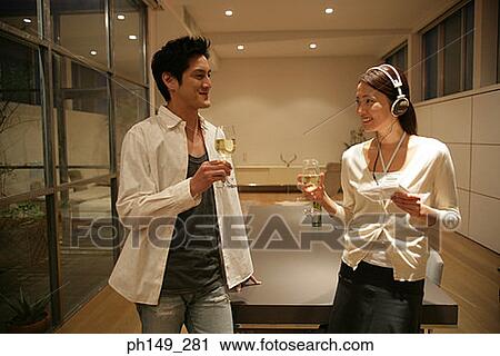 Close-up of a young couple smiling and looking at each other View Large Photo Image Stock Image - Close-up of a young couple smiling and looking at each other. Fotosearch