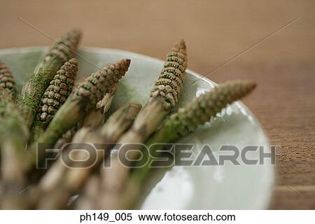 Stock Photography - Close-up of asparaguses in a plate. Fotosearch