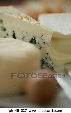 Stock Photo - Close-up of assorted cheese slices. Fotosearch