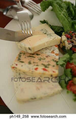 Close-up of cheese slices being cut with a knife and a fork View Large Photo Image Stock Photo - Close-up of cheese slices being cut with a knife and a fork. Fotosearch