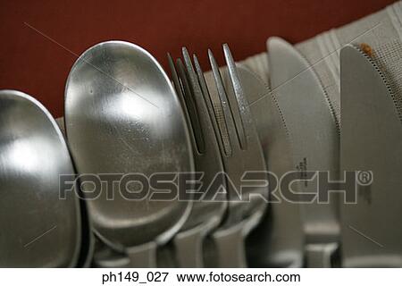 Close-up of forks and spoons with table knives View Large Photo Image Stock Photo - Close-up of forks and spoons with table knives. Fotosearch