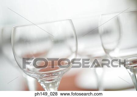 Close-up of four empty wine glasses View Large Photo Image Stock Photo - Close-up of four empty wine glasses. Fotosearch