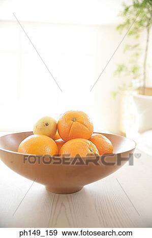 Stock Photo - Close-up of oranges in a fruit bowl. Fotosearch