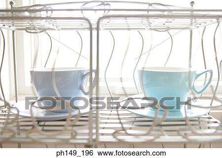 Close-up of tea cups and saucers View Large Photo Image Stock Photograph - Close-up of tea cups and saucers. Fotosearch
