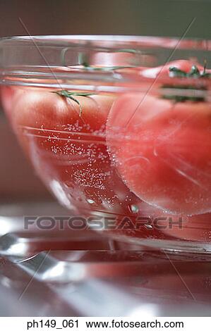 Close-up of tomatoes in a bowl View Large Photo Image Stock Image - Close-up of tomatoes in a bowl. Fotosearch