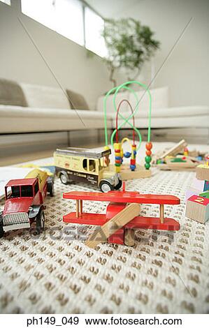 Close-up of toys on a mat in the living room View Large Photo Image Stock Photo - Close-up of toys on a mat in the living room. Fotosearch