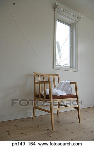 Empty chair in a living room View Large Photo Image Picture - Empty chair in a living room. Fotosearch
