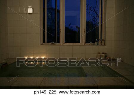 Four candles on the side of a bathtub View Large Photo Image Stock Photography - Four candles on the side of a bathtub. Fotosearch
